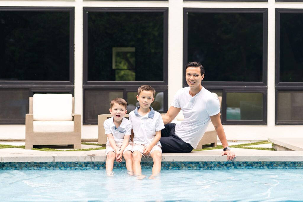 A family having fun doing photos in their pool during the best time of year for family photos, in Austin, Texas
