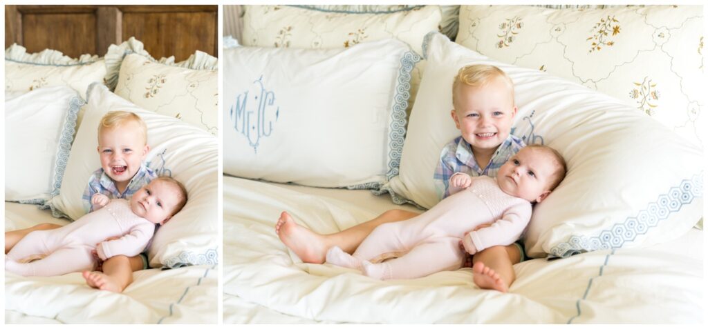 A big brother holding his little sister on mom and dad's bed as they have photos taken in Austin with Alissa Cordoba Photography.