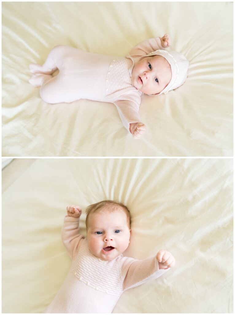 A newborn in a knitted pink outfit, stretched out on her parents bed, while having photos taken in Austin, Texas.