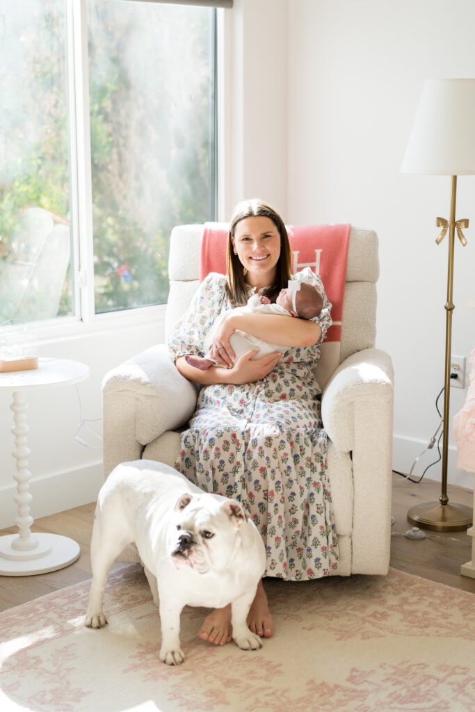 Mother and father snuggling their newborn in a cozy Austin home, taken by an Austin newborn photographer.