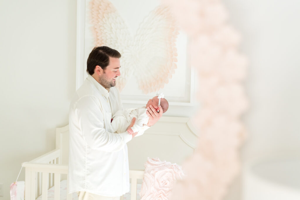 Candid newborn portrait in an Austin home, showing soft baby details and natural light.