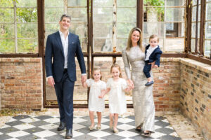 Young family with their 3 children, having their family photo session at Sekrit Theater with Alissa Cordoba Photography.