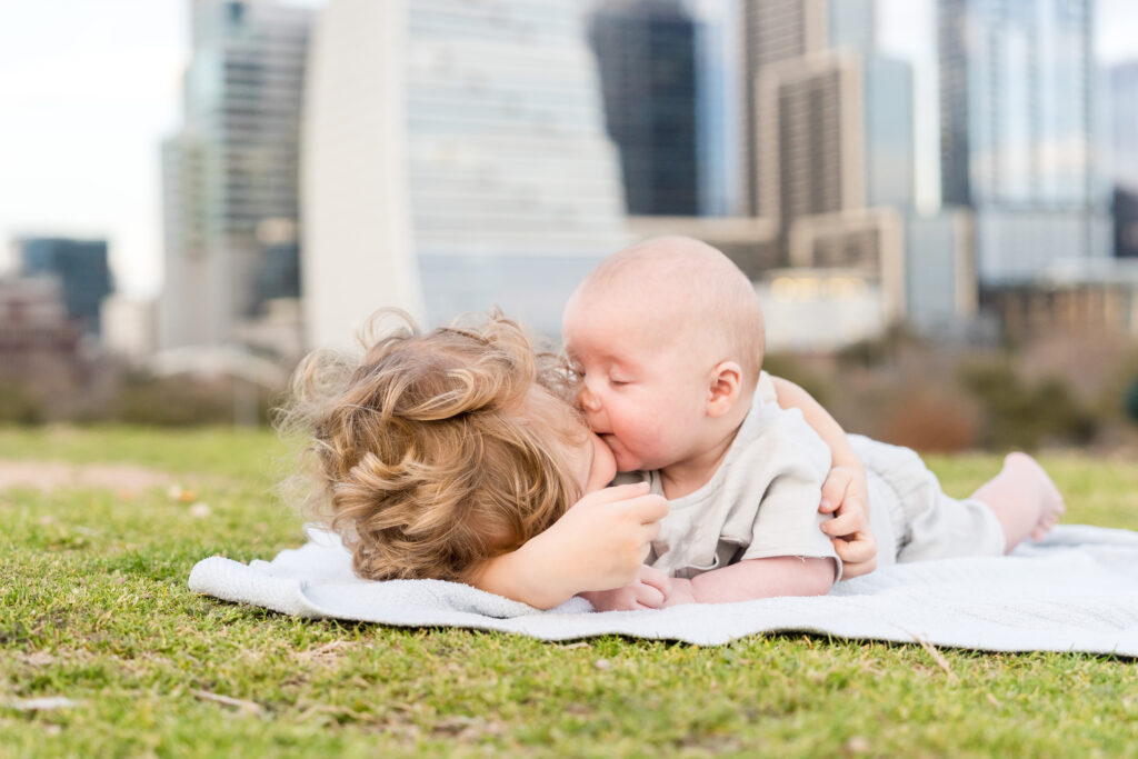 Two brothers cuddling during their family photo session with Alissa Cordoba Photography.