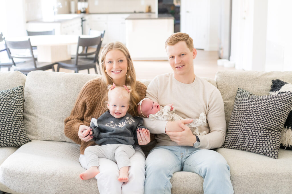 A family doing a lifestyle newborn photo session in their Austin home.