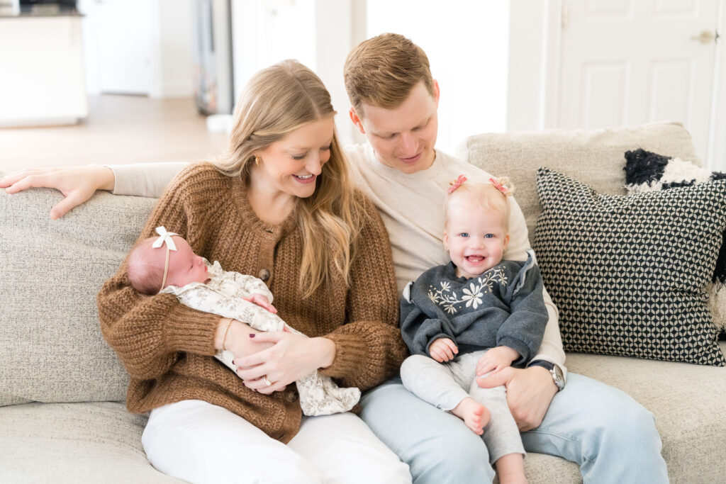 A family doing a lifestyle newborn photo session in their Austin home.