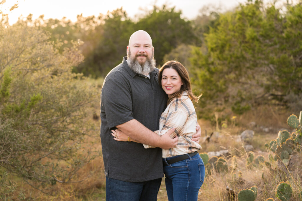A husband and wife posing for photos during their family photo session with Alissa Cordoba Photography.