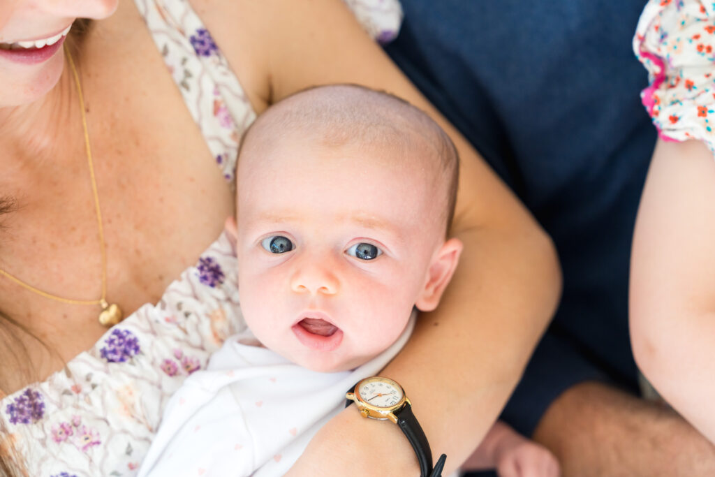 A newborn girl having her photo taken with Austin family photographer, Alissa Cordoba.
