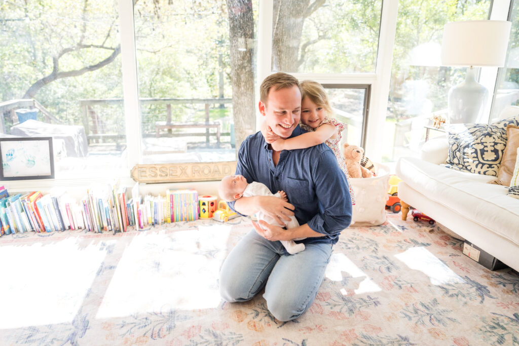 A family having fun in their playroom as their Austin family photographer takes their photo.
