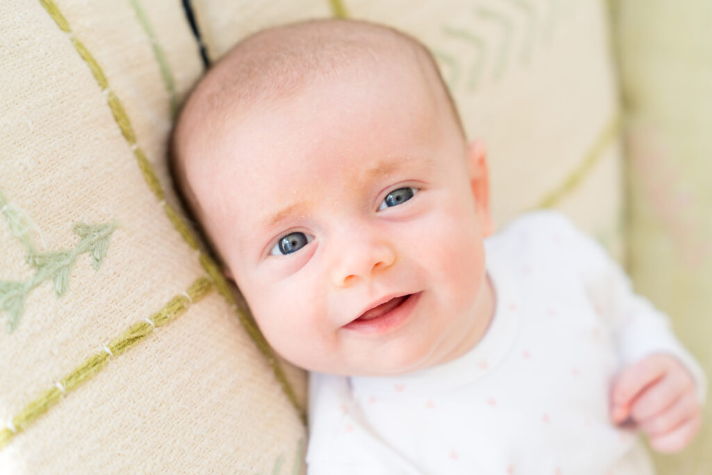 A newborn girl having her photo taken with Alissa Cordoba Photography, an Austin family photographer.