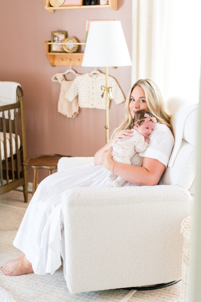 Mom and Baby snuggling during their lifestyle newborn session in Austin.