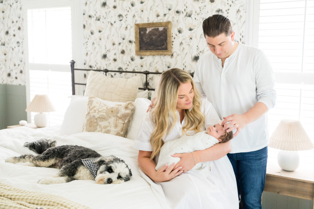 Mom, Dad, baby and their family dog during their lifestyle newborn session with Alissa Cordoba Photography.