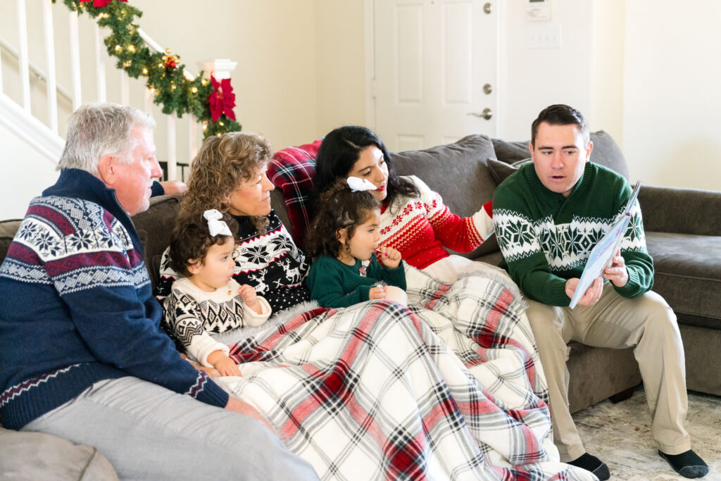 Family cuddled together during a December family photo session in Austin