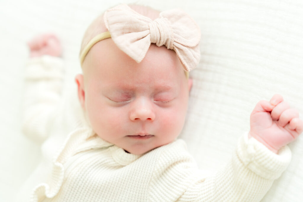 Newborn sleeping peacefully during family photo session