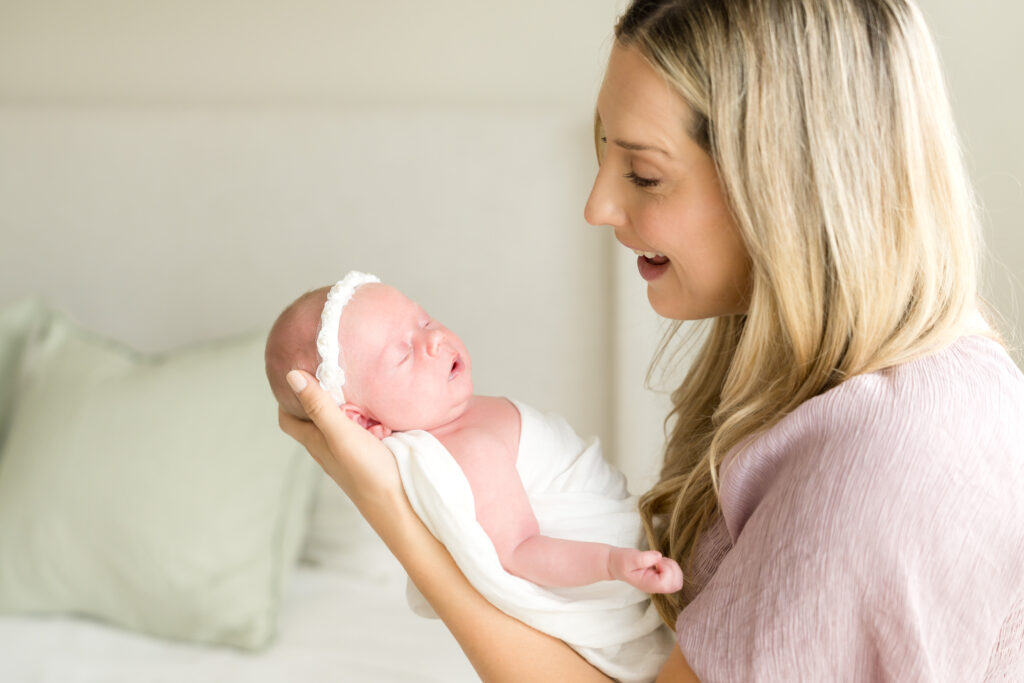 Mother and baby during newborn photography session at home
