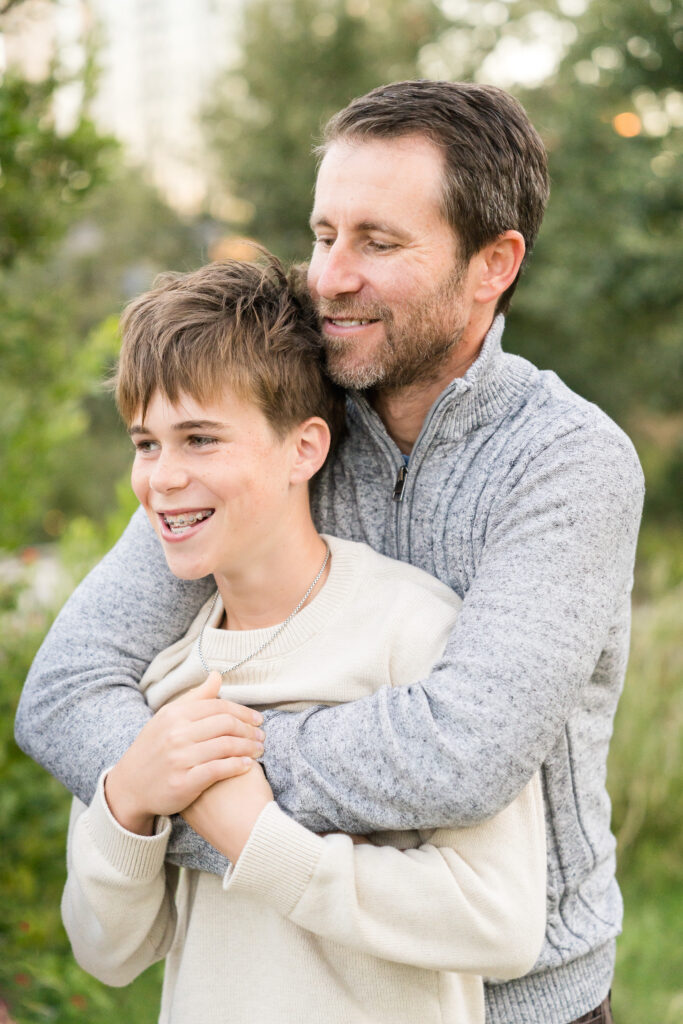 Parent and child candid moment during a family photography session at Waterloo Park Austin