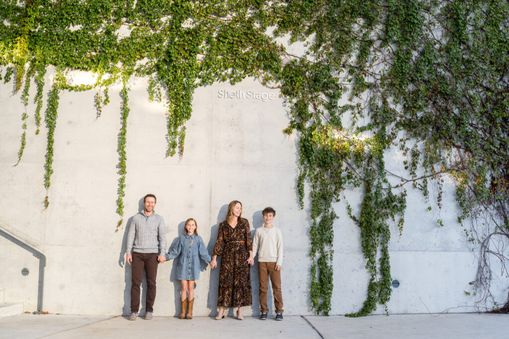 Family walking together at Waterloo Park during an evening family photography session in Austin Texas